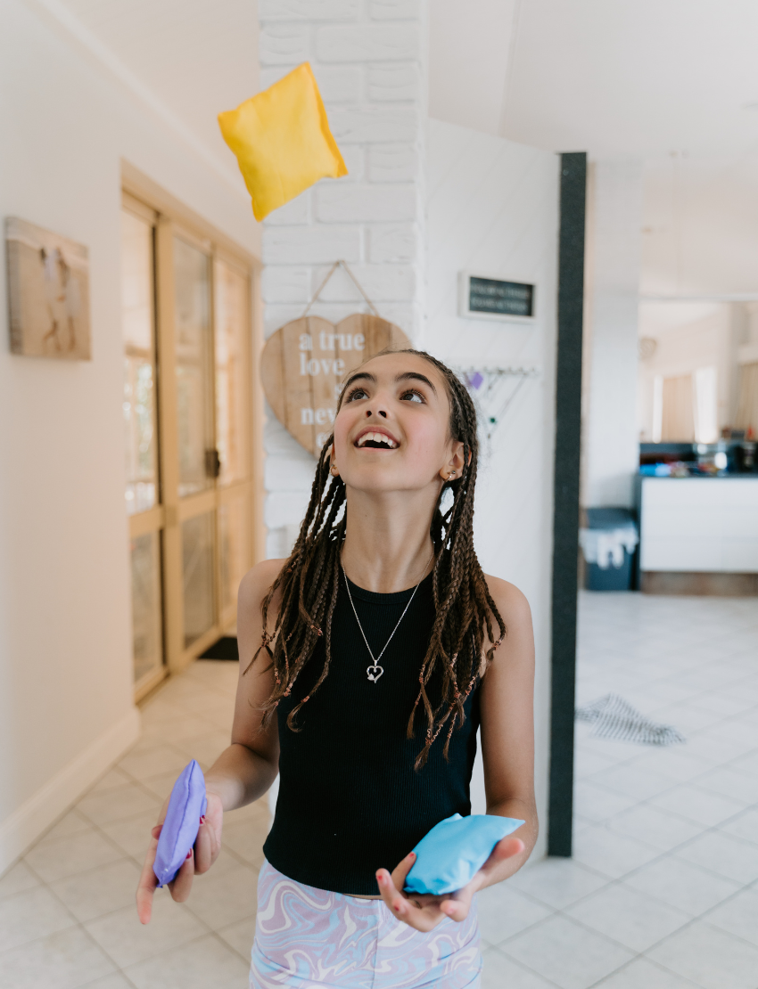 A white box with colorful geometric shapes has "Bean Bags" and "Sensory Play Australia" on the front. Ideal for motor skills and sensory regulation, it offers more than just fun—it's a developmental journey.