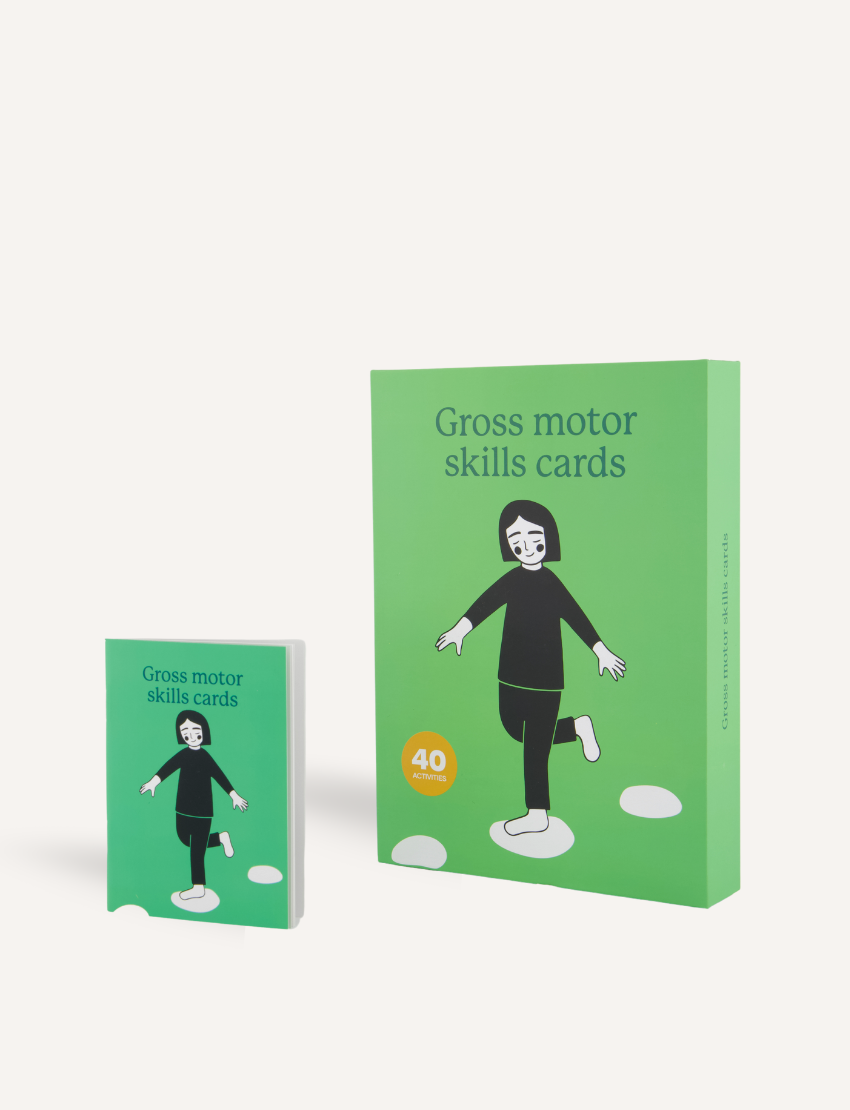 Two green boxes titled "Gross Motor Skills Cards Set" from Sensory Play Australia focus on physical development. The smaller box is on the left, while the larger one with a stepping-stones illustration is on the right. Each contains 40 cards designed to improve gross motor skills.