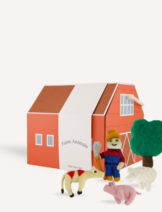 The "Farm Animals Felt Play Set" from Sensory Play Australia features a red barn box, felt figures of a farmer in blue overalls and hat, plus a goat, pig, sheep, and tree for imaginative storytelling. Perfect for pretend play with colorful animals and accessories.