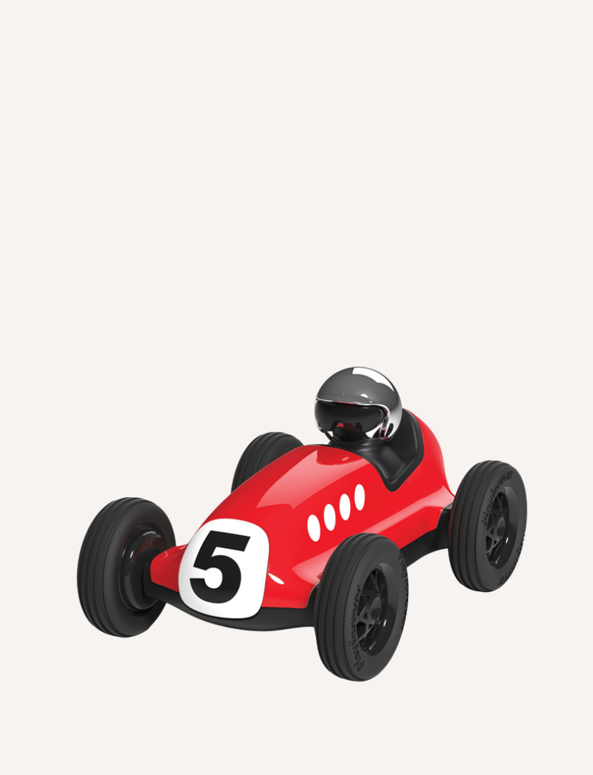 Red vintage toy race car with number 5, black wheels, and a driver in a helmet.