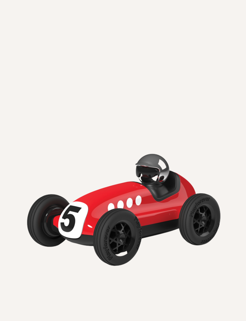 The Verve Loretino Marino toy car by Playforever is displayed against a plain white background. This stylish red race car, with black wheels and the number 5 on its front, boasts a sleek design and features a small driver's seat with a silver helmet.