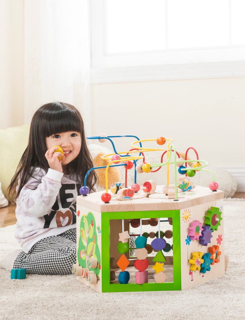 The EverEarth Educational 7-in-1 Garden Activity Cube is vibrant with colorful bead mazes, spinning gears, shape sorters, and sliding beads to enhance fine motor skills. Decorated with butterfly and flower designs, this delightful cube offers engaging activities for children.