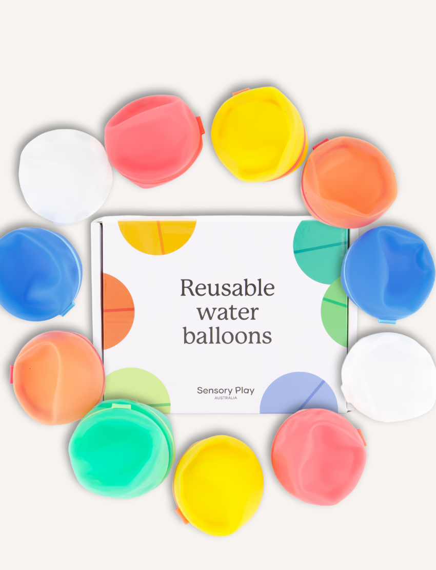 A white rectangular box with colorful circles features the text "Reusable Water Balloons" prominently. The eco-friendly package by Sensory Play Australia is set against a simple, light background.