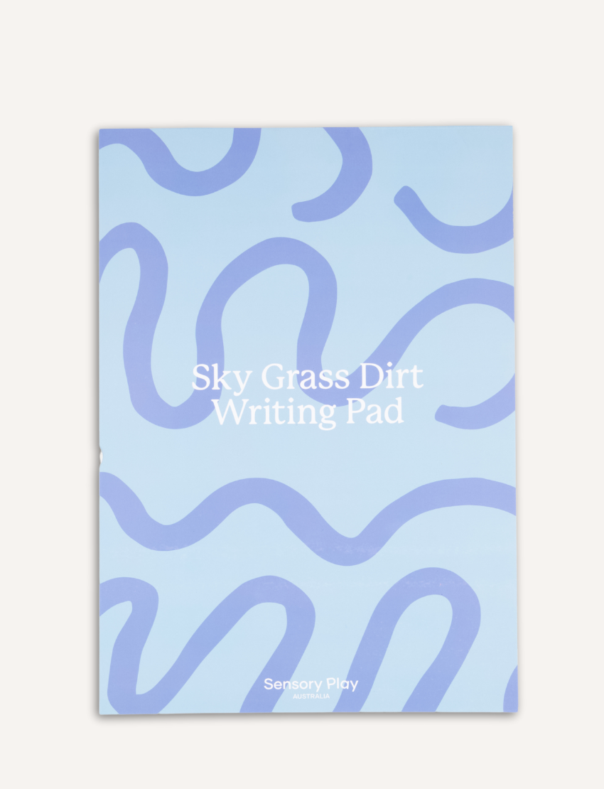 The Sky, Grass, Dirt Writing Pad - A4 by Sensory Play Australia features a light blue cover with abstract dark blue wavy lines. Ideal for handwriting practice.