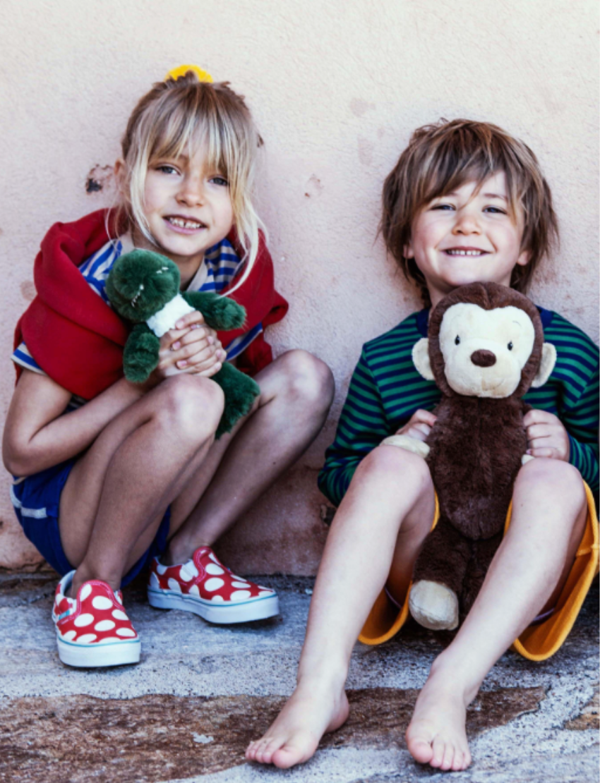 A WWF Plush Animals 29cm featuring a dark blue elephant and brown-beige monkey, both made from recycled PET materials, rest on a plain backdrop. These eco-friendly companions are ideal for conservation-minded individuals.