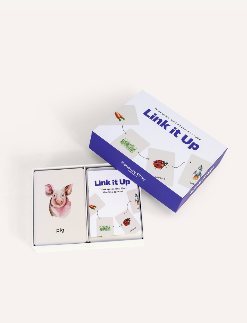 The image features the "Link it Up Game" by Sensory Play Australia, in a boxed set with a purple border. The front showcases cards linking a carrot, grass, ladybird, and rocket, and reads "Think quick and find the link to win!" Ideal for family fun and boosting word association skills!.