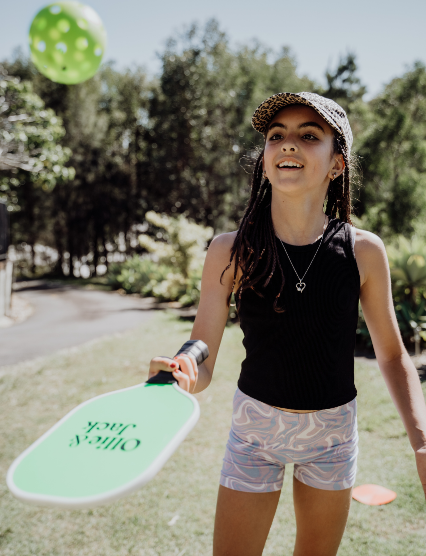 Ollie & Jack's LED Pickleball Bat Set includes two vibrant green paddles with black handles and the brand's logo, making it perfect for an exciting game for ages 6 and up.