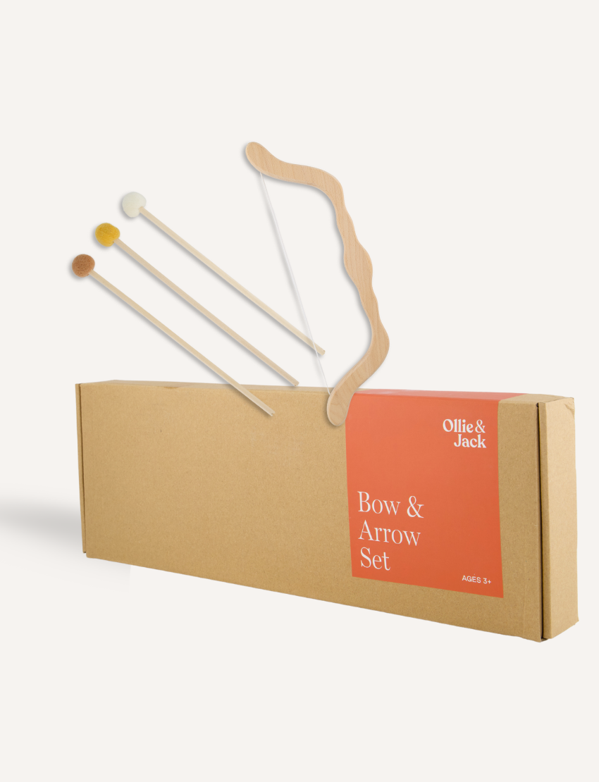 The Ollie & Jack Bow & Arrow Set is a classic wooden toy set for ages 5+, featuring a bow with a string and three soft-tipped arrows in white, yellow, and brown, ideal for developing strength during active play.