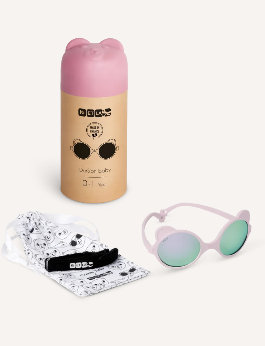 Four pairs of trendy OURS'ON sunglasses by Ki ET LA for ages 2-4 are stylish and safe: dark blue with UV reflective lenses, cream with beige lenses, pink with rose-tinted lenses, and lilac with light blue lenses—perfect for kids' fashion.