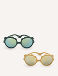 Two pairs of Ki ET LA's LION sunglasses for 2-4-year-olds are displayed. One, made in France, has dark frames with blue-tinted lenses; the other features light yellow frames with gold-tinted lenses. Both have round, unbreakable lenses and decorative frame accents.