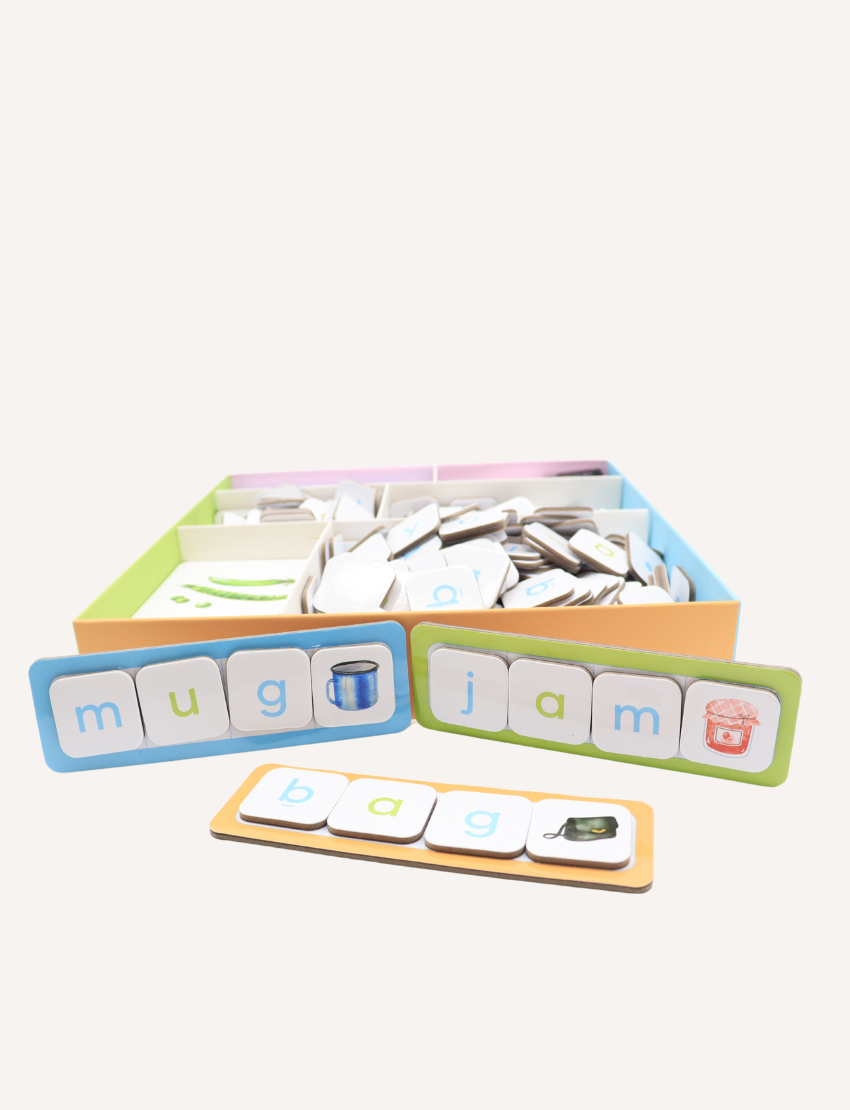 A white box titled "CVC Word Builders Game" by Sensory Play Australia displays colorful letters and images like a cat and worm to enhance phonemic awareness. The bright green side reads "CVC Word Builders," making literacy skills fun and engaging.