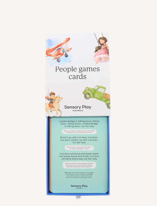 Two sets of "People Games Cards Set" by Sensory Play Australia are displayed. One set is opened, showing fanned-out cards such as "Horsey Rides" featuring a child on a rocking horse, ideal for interaction and communication enhancement. The other set is sealed.