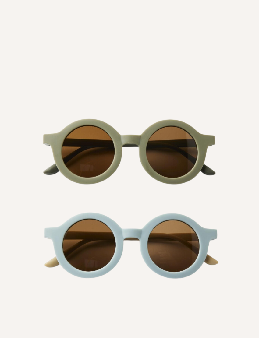 Two pairs of Nuuroo's Anna Sunglasses with dark polycarbonate lenses are shown on a neutral background. The top pair has a light olive frame, and the bottom pair is light blue. Both offer UV400 protection for safe, stylish sun exposure.