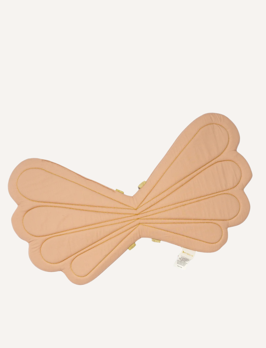 The Fairy Wings - Old Rose by Fabelab are a pair of fairy-inspired fabric wings crafted from organic cotton. These light brown wings feature scalloped edges and are secured with gold straps.