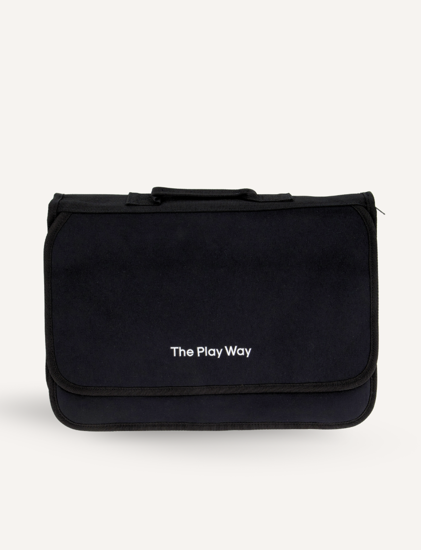 The Play Way Compendium, a closed black fabric bag with the logo, designed for organizing writing tools to support fine motor skills.