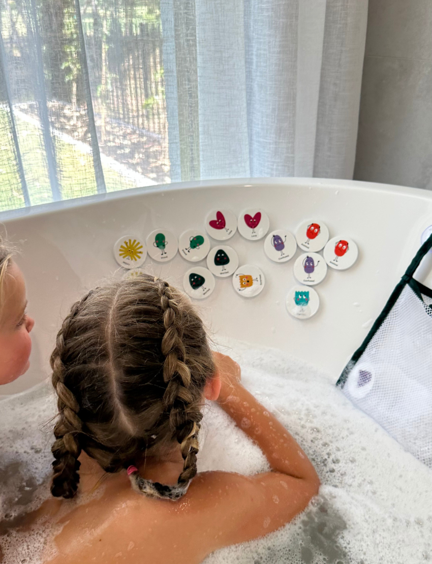 The "Bath Memory: Emotions" package by Sensory Play Australia offers fun learning. The blue packaging, adorned with colorful cartoon faces, contains 24 pieces that stick to the tub and tiles when wet, making emotions bath time both enjoyable and educational.