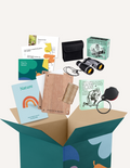 The Time in Nature Handwriting Kit by The Play Way is a teal cardboard box filled with items for outdoor exploration. Visible contents include a pair of binoculars, a magnifying glass, nature activity cards, a spool of twine, and two small booklets titled 