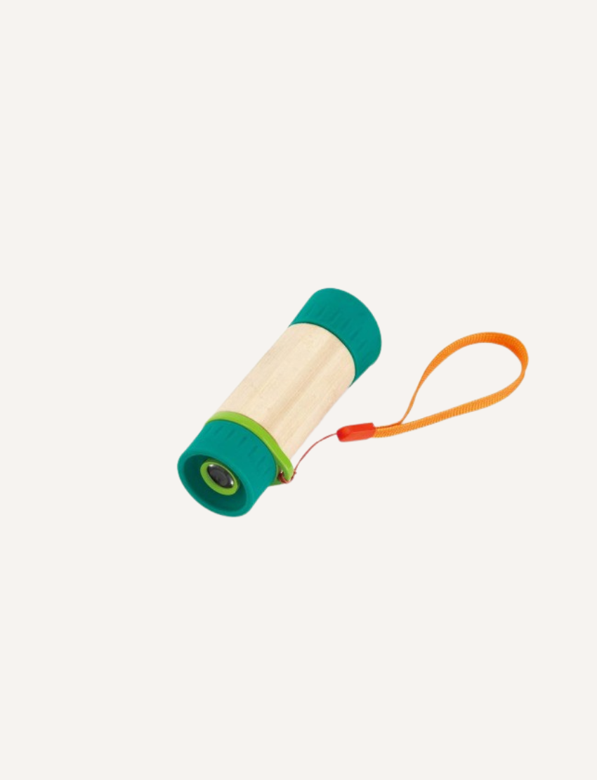 A compact, vibrant Hape Adjustable Telescope with a wooden body, green ends, and a bright orange strap lies against a plain white background.