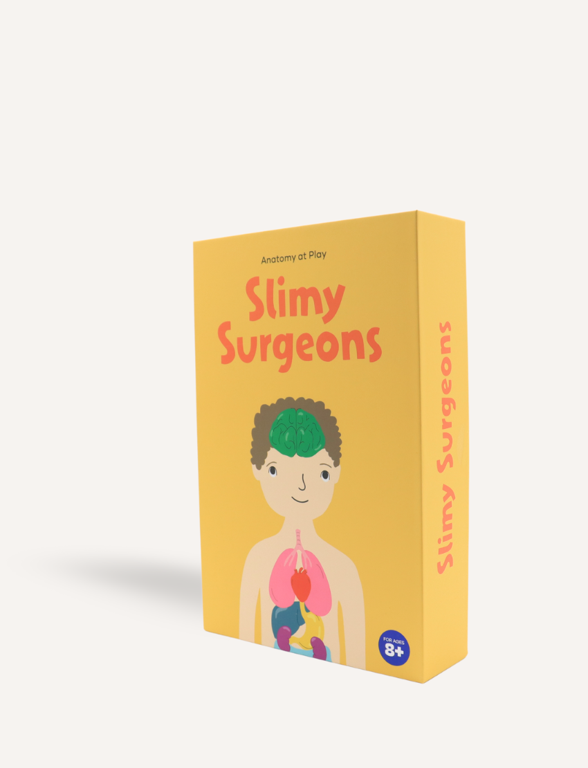 The yellow Slimy Surgeons box by Sensory Play Australia displays its title in red and features an illustrated person with visible brain and organs, marked as suitable for ages 8+.