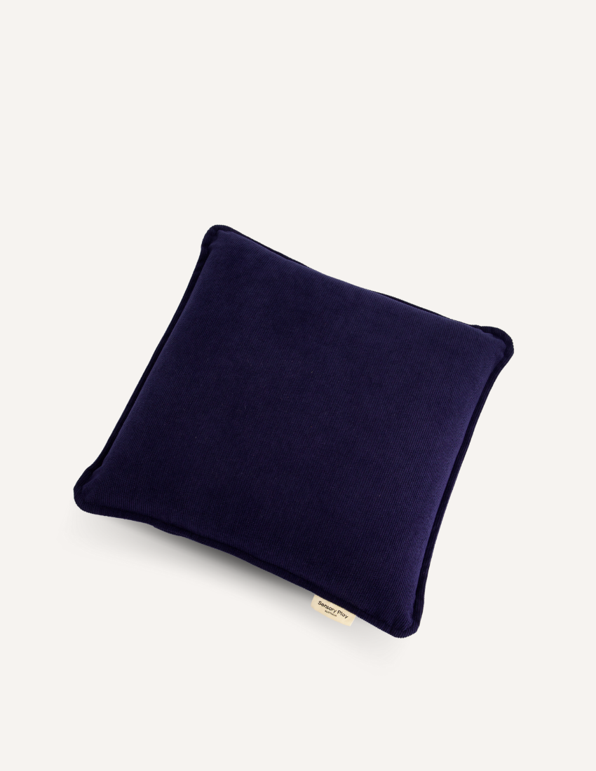 Sensory Play Australia Vibrating Cushion, a dark navy ribbed pillow offering soothing tactile input for sensory regulation and calm.