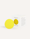 A teal box from The Play Way containing the Calm Story Kit is open, revealing a yellow squishy ball and a small booklet titled 