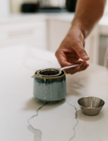 The Therapy At Home Caregiver Wellbeing Training Program includes a ceramic mug, bath salts, aromatherapy eye pillow, tea, notepads, colored pencils, and booklets—perfect for supporting caregiver wellbeing and emotional regulation.