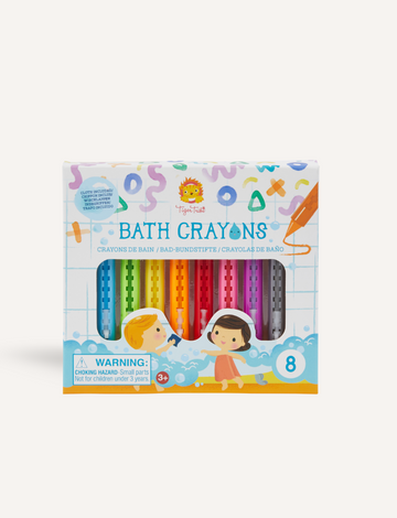 The Tiger Tribe Bath Crayons are presented in a box containing eight vibrant colors. The packaging showcases illustrations of two children alongside an array of colorful doodles. A warning label advises that the product poses a choking hazard for children under three years, and the crayons are deemed suitable for ages 3 and up.