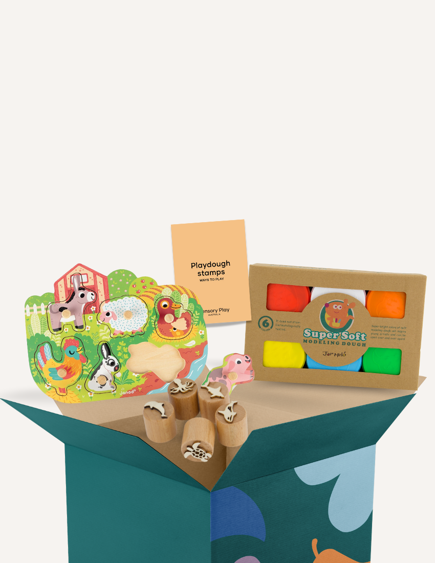 The Play Way's therapist-developed Fine Motor Practice Kit, with farm puzzle, dough, and stamps, enhances hand strength.