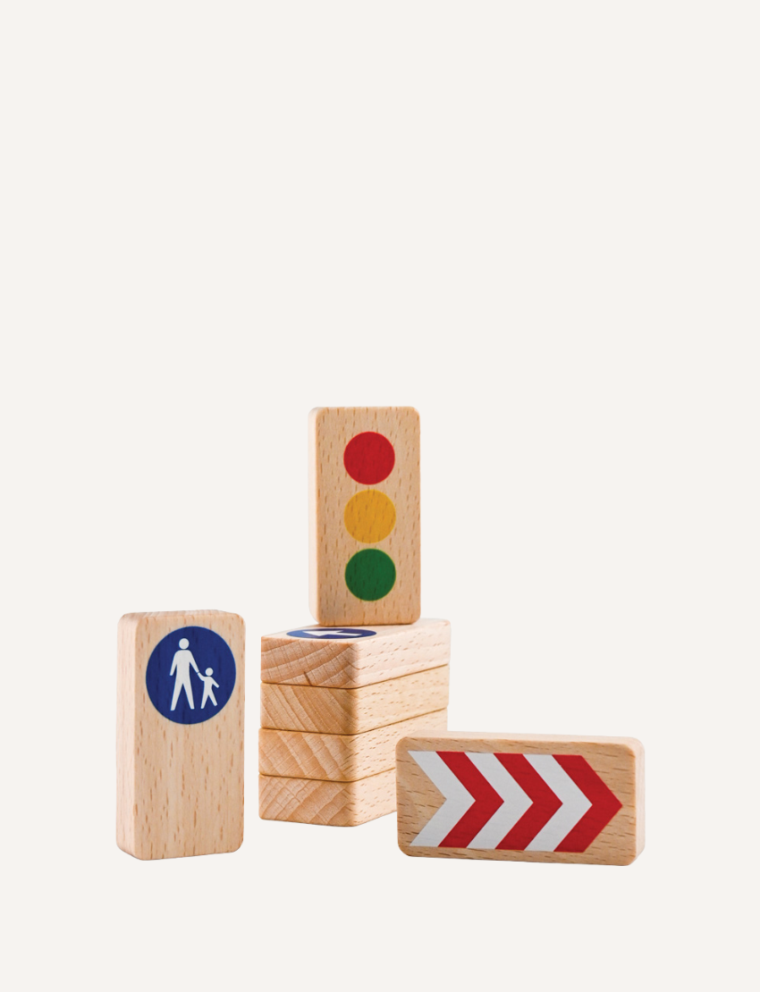 Wooden toy traffic signs: pedestrian crossing, turn right arrow, and traffic light.
