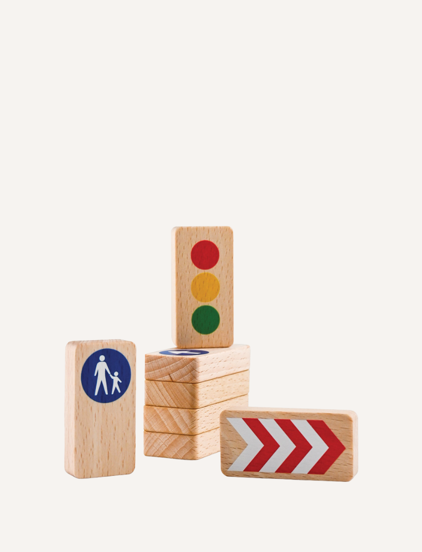 Introducing the Road Blocks Set Traffic Signs by Waytoplay, a charming collection of wooden toy blocks featuring traffic symbols. This set includes a block with a pedestrian sign, another showcasing a traffic light, and a third adorned with red and white arrows. The blocks can be displayed both upright and lying flat for versatile play.