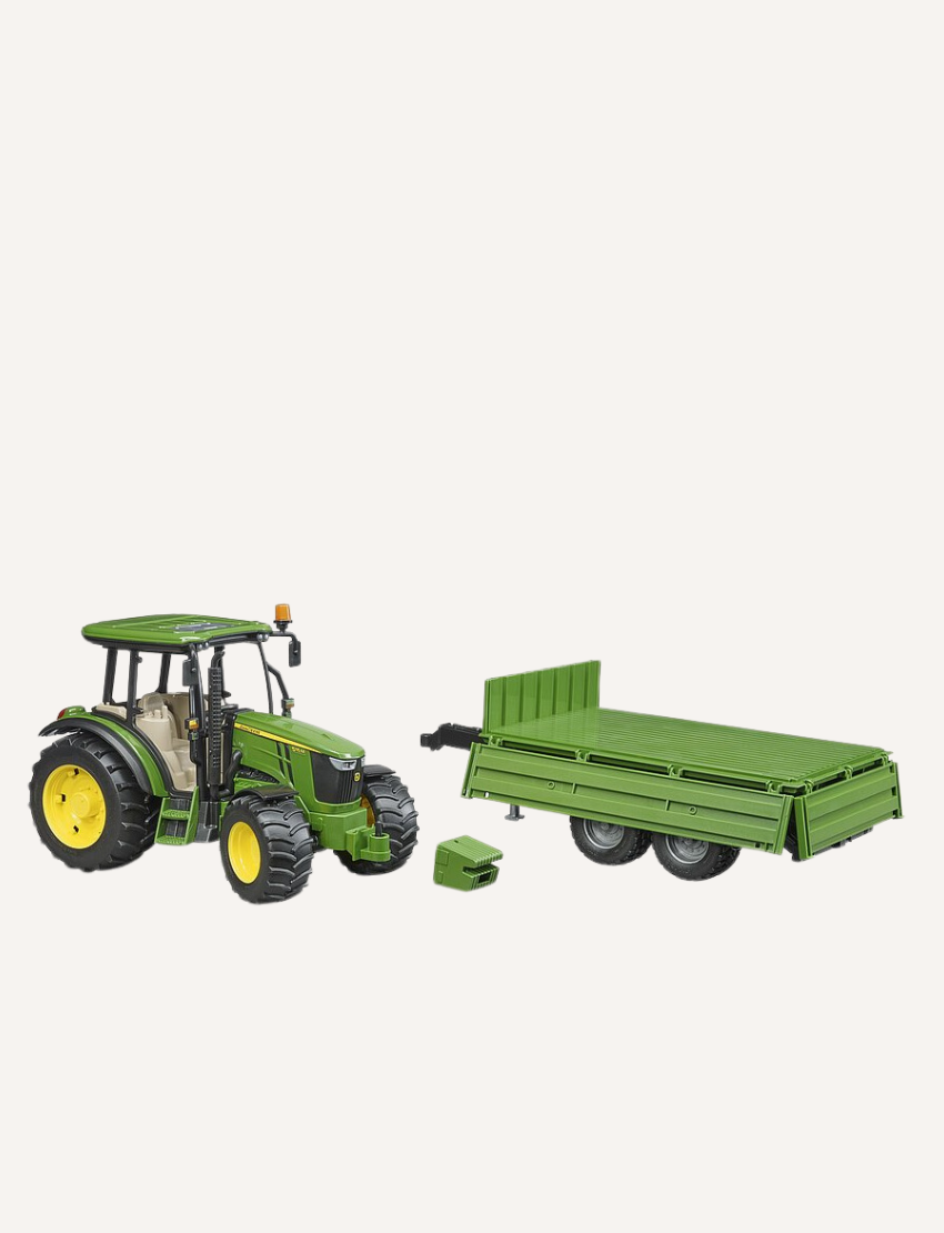 The Bruder John Deere Tractor with Tipping Trailer by Bruder is a compact toy green tractor featuring a yellow wheel trim, paired with a matching tandem-axle trailer. The trailer has two sets of wheels and an open cargo area, ideal for transporting loads during play. The setup is displayed against a plain white background.