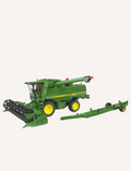 A Bruder John Deere Combine Harvester in green, complete with yellow wheels, is showcased with its header detached and positioned beside it. This T 670i model features a meticulously detailed exterior that captures the essence of traditional agricultural machinery.