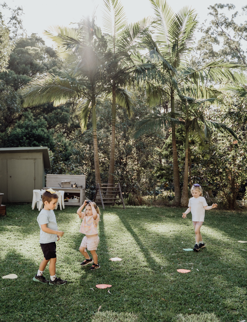 A box labeled "Spot Markers" from Sensory Play Australia features large colored dots in green, blue, red, and purple to boost gross motor skills and fitness.