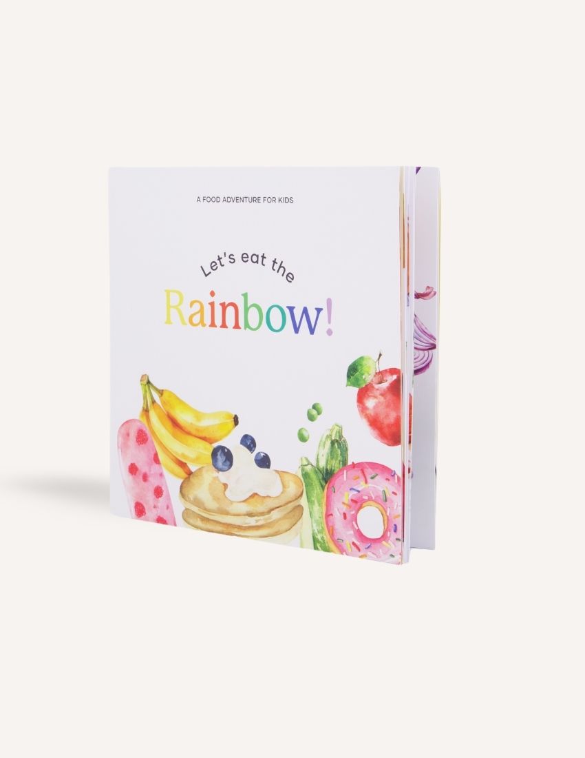 Sensory Play Australia's "Let's eat the Rainbow Storybook" features delightful illustrations of various colorful foods, including pancakes with blueberries, a donut, bananas, an apple, and a popsicle on the cover. This enchanting tale encourages healthy eating through joyful food exploration for kids.