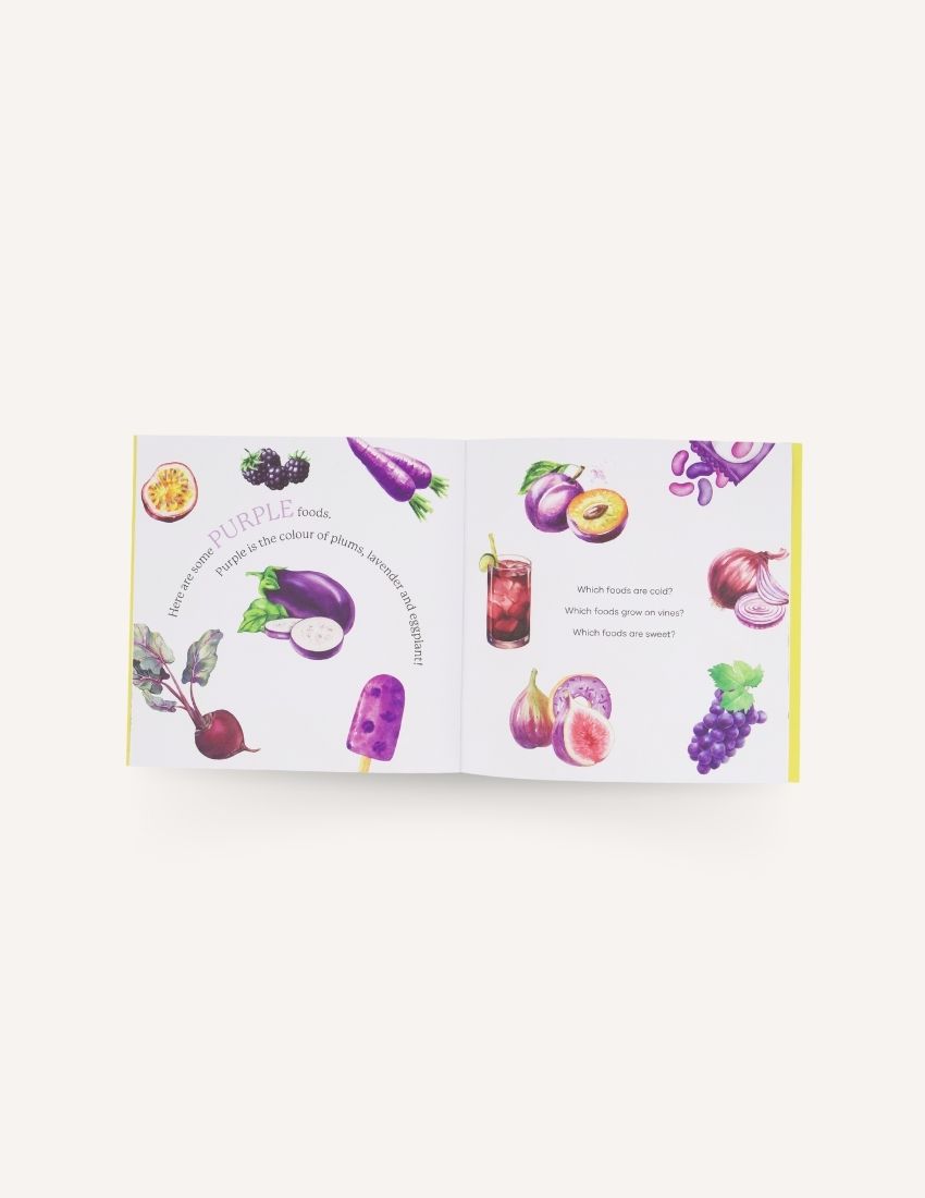 A children's book titled "Let's Eat the Rainbow Storybook" by Sensory Play Australia is shown against a white background. The cover, featuring colorful illustrations of various foods like bananas, pancakes with blueberries, apples, and a donut, invites young readers to embark on a food exploration journey while promoting healthy eating habits.