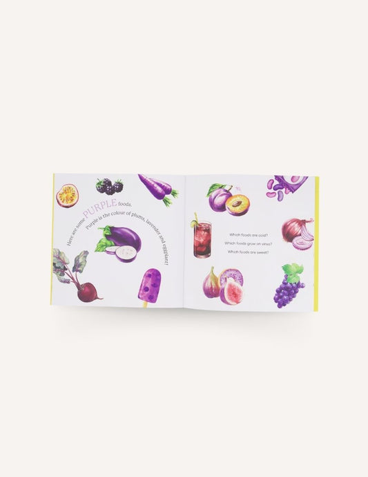 A children's book titled "Let's Eat the Rainbow Storybook" by Sensory Play Australia is shown against a white background. The cover, featuring colorful illustrations of various foods like bananas, pancakes with blueberries, apples, and a donut, invites young readers to embark on a food exploration journey while promoting healthy eating habits.