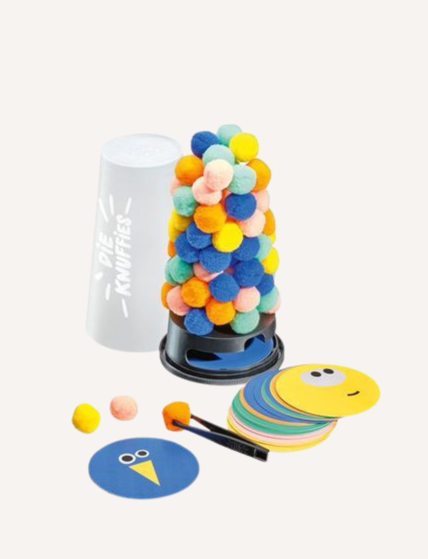 A vertical arrangement of small, colorful pom-poms from The Fuzzies Game by VR Distribution stands on a black base, featuring vibrant hues such as blue, green, orange, pink, and yellow.