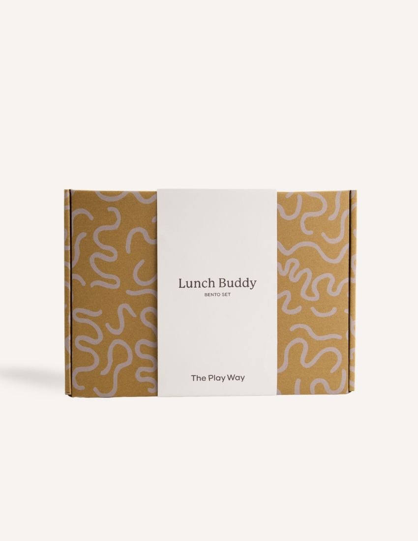 Introducing the Lunch Buddy Bento Set by The Play Way, a sleek rectangular stainless steel lunchbox with multiple compartments. The top right section is larger than the others, with "TPW" engraved in the central compartment. It features a silicone seal lid, rounded edge design, clasp closure, and a polished metallic finish.