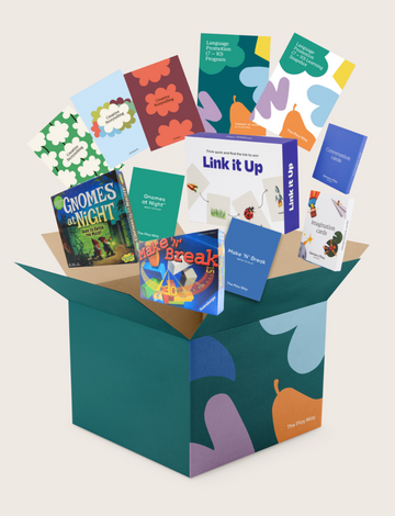 An open Therapy At Home Language Promotion Program box with playful green and teal designs reveals educational books, cards, and colorful language development activity materials neatly arranged inside.