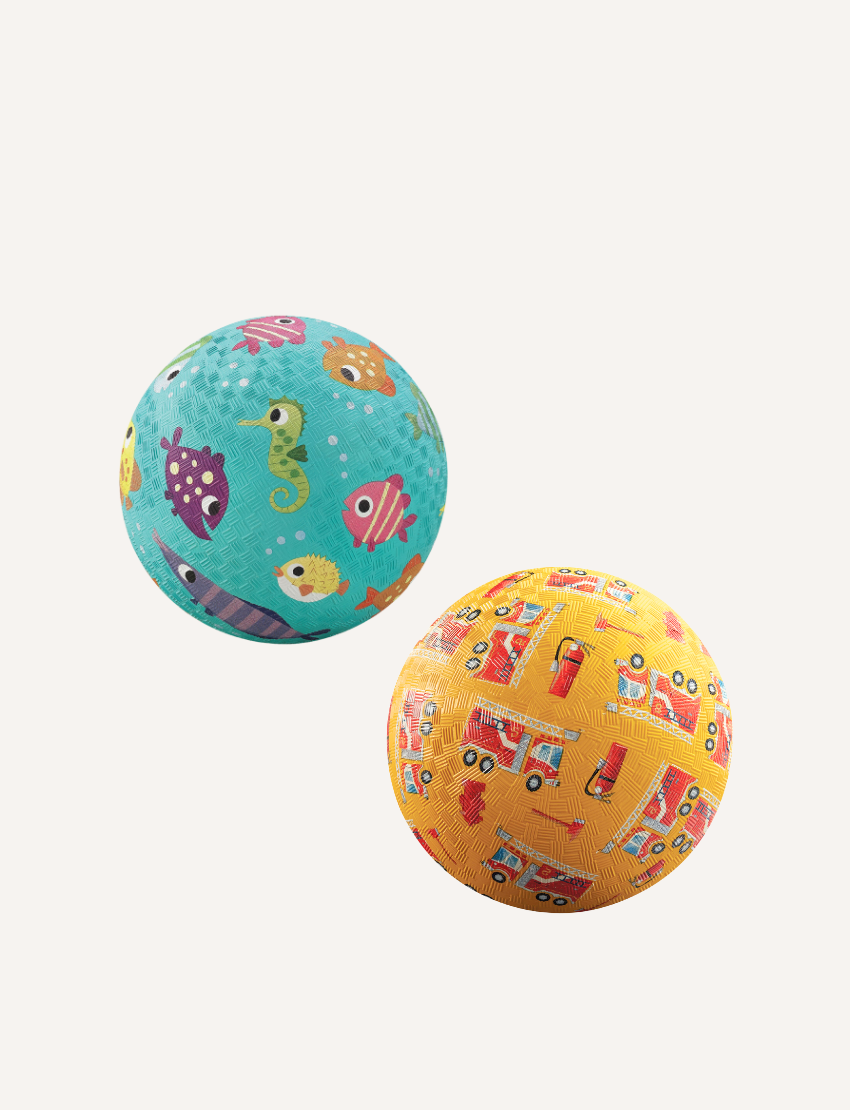 The Crocodile Creek 5 Inch Playground Ball features a vibrant yellow design with textured fire truck and hydrant illustrations. Ideal for active play, it enhances gross motor skills against a simple white background.