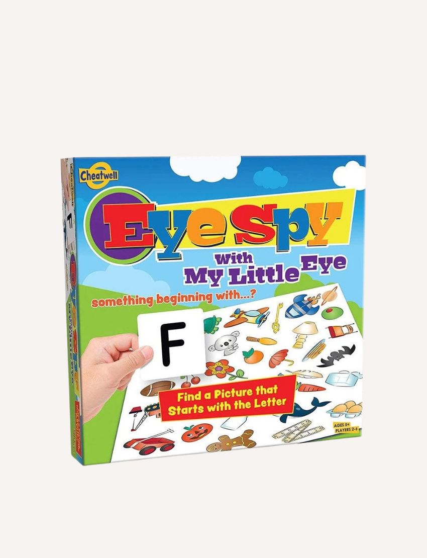 The Cheatwell Eye Spy With My Little Eye Game is a kids board game with a blue, cloud-themed box, colorful letters, object images, and a hand holding an "F" card—highlighting this fun observation game and its engaging components.