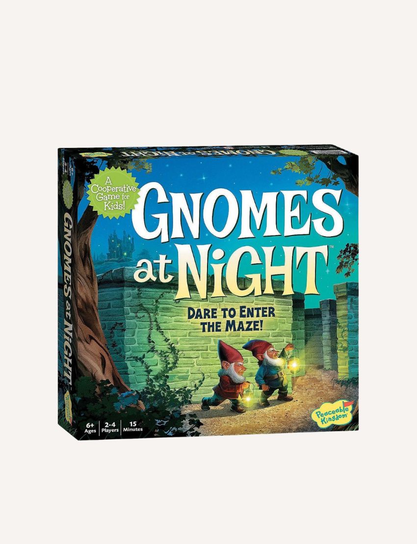 The image shows the box for the Gnomes at Night Game by Peaceable Kingdom, featuring two gnomes with lanterns in front of a stone maze, set against trees and a night sky.