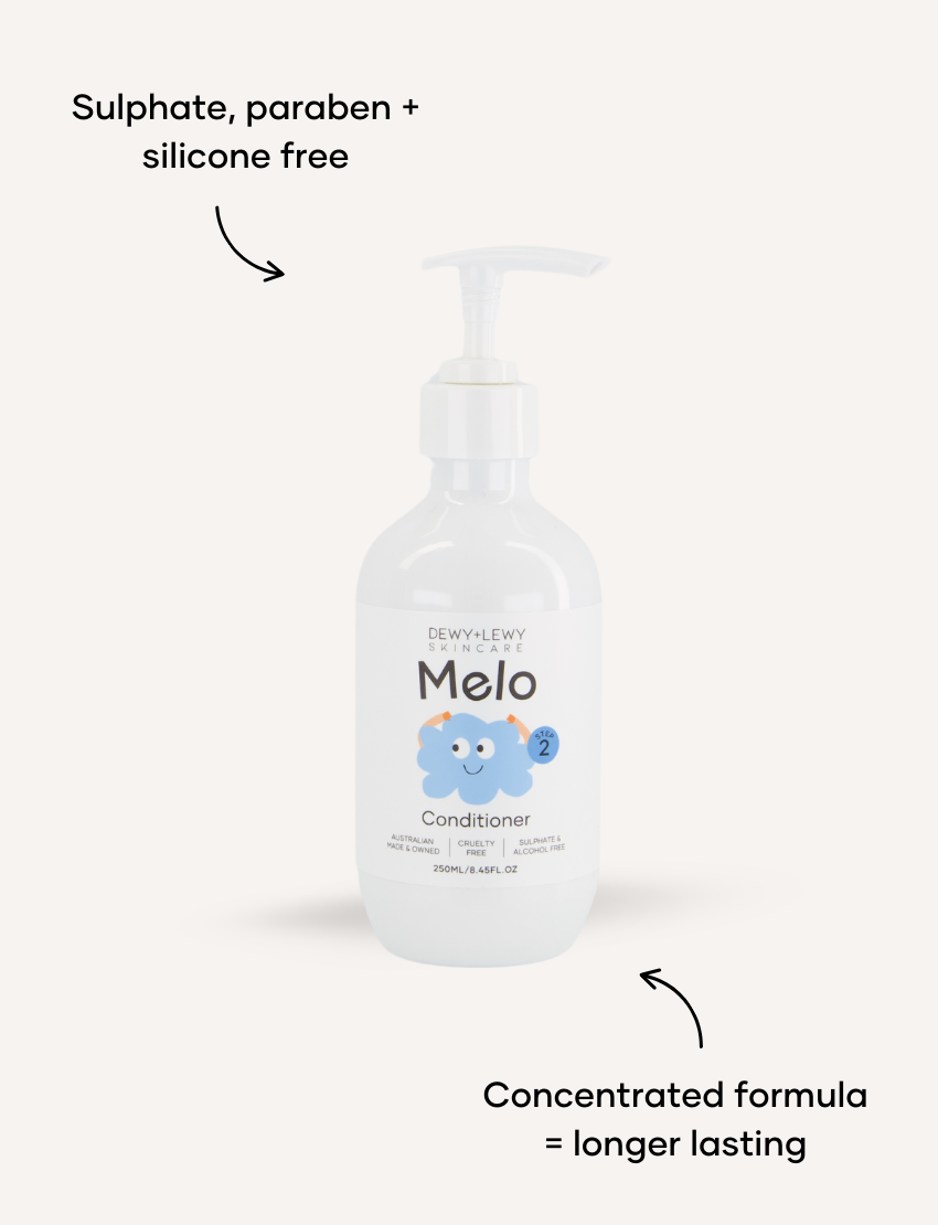 Two bottles of Melo's Melo Conditioner are displayed. One bottle faces forward, showcasing the product label, while the other faces backward, displaying the ingredient list and information. Both bottles, designed for babies with a gentle formula, feature white pumps and are paraben-free.