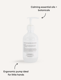 Melo Shampoo bottle: back view. Calming essential oils. Ergonomic pump ideal for little hands.