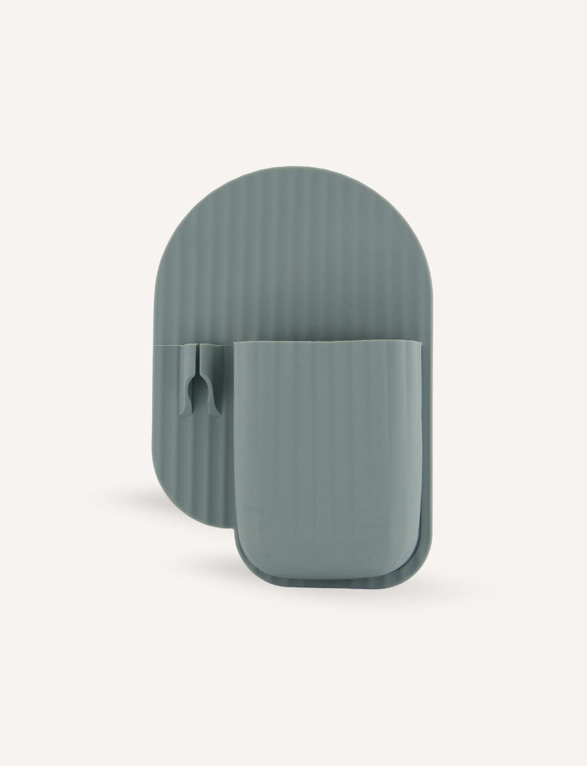 The Bathroom Organiser and Shower Mirror Set by Sensory Play Australia includes a green, rectangular magnifying glass with a fold-out stand that's perfect for aiding self-care routines. The stand features a curved, ribbed texture and folds into a compact, portable size, making it an ideal addition to your bathroom organiser.