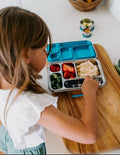 Introducing the Lunch Buddy Bento Set by The Play Way, a sleek rectangular stainless steel lunchbox with multiple compartments. The top right section is larger than the others, with 