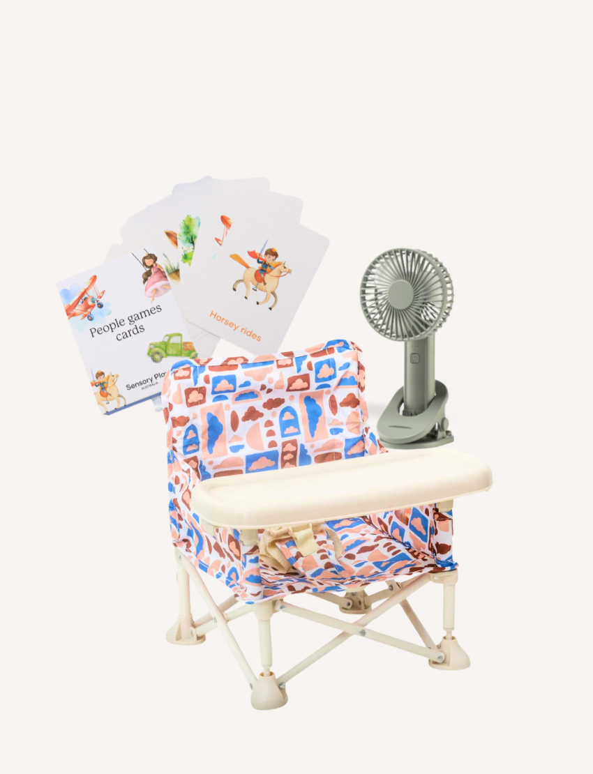 The IZIMINI Baby Chair features a lightweight, portable design with a foldable metal base and floral fabric in orange, blue, and purple, plus a beige plastic tray.