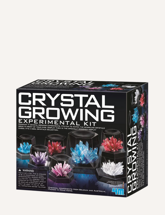 The 4M Toys Crystal Growing Kit provides a colorful crystal experience with dazzling red, purple, blue, and white crystals showcased on the packaging. Ideal for chemistry experiments, the box highlights the kit's contents and purpose.