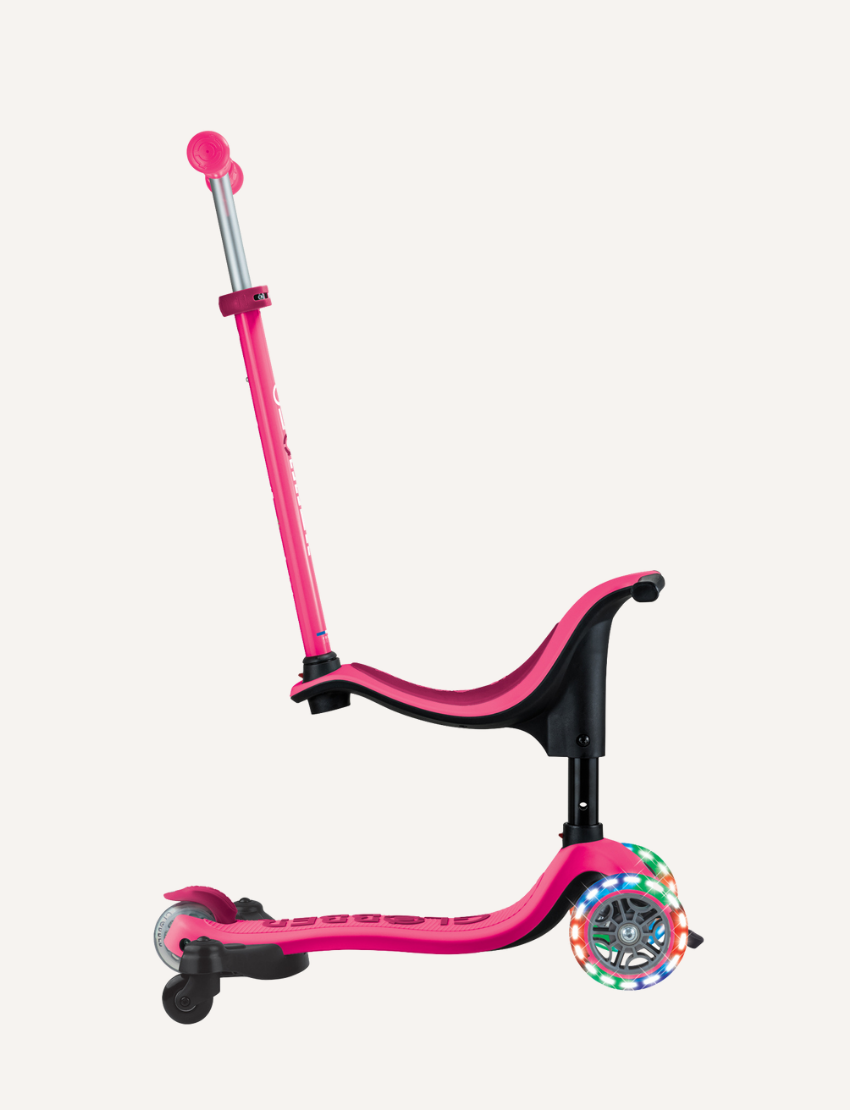 The Globber Go Up Sporty Lights 360 - Deep Pink is a versatile three-wheel children's scooter with an adjustable handlebar. It offers vibrant LED wheels and a seat attachment, making it ideal for young riders.