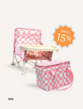 The IZIMINI Chair and Lunch Bag Bundle features three baby chairs with trays in colorful patterns—purple checkered, pink-themed, and blue-themed—ideal for ages 6 months to 3 years. A 